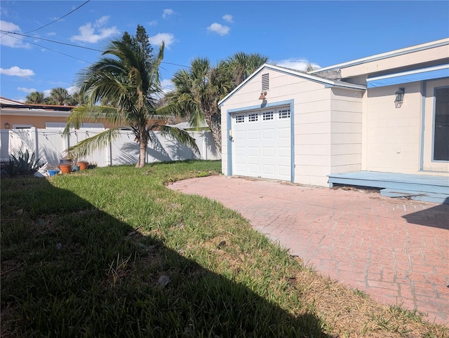 garage with a lawn