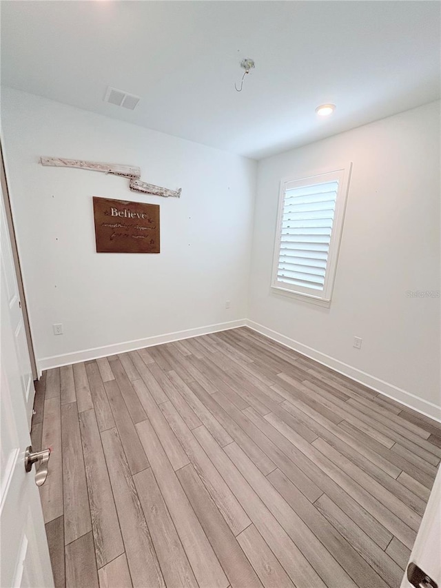 unfurnished room featuring light wood-type flooring