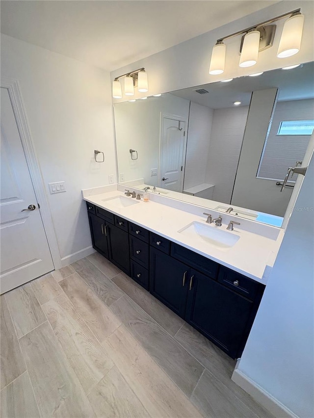 bathroom featuring vanity and hardwood / wood-style flooring