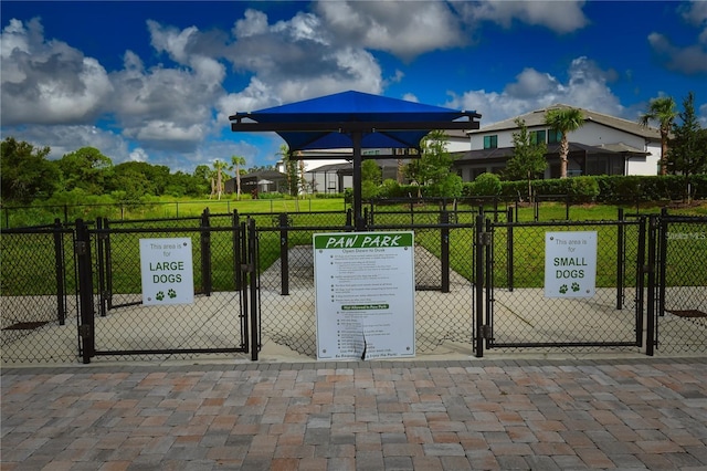 view of gate featuring a lawn