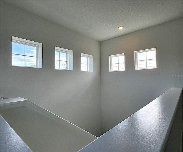 interior space featuring a textured ceiling