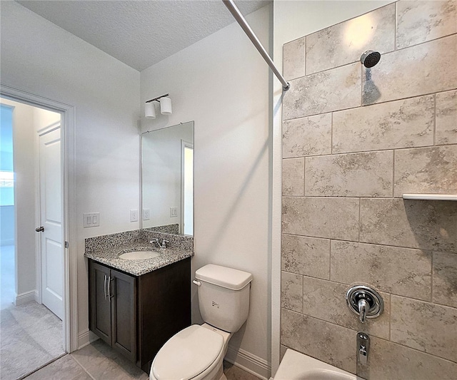 full bathroom with tile patterned flooring, tiled shower / bath, a textured ceiling, vanity, and toilet