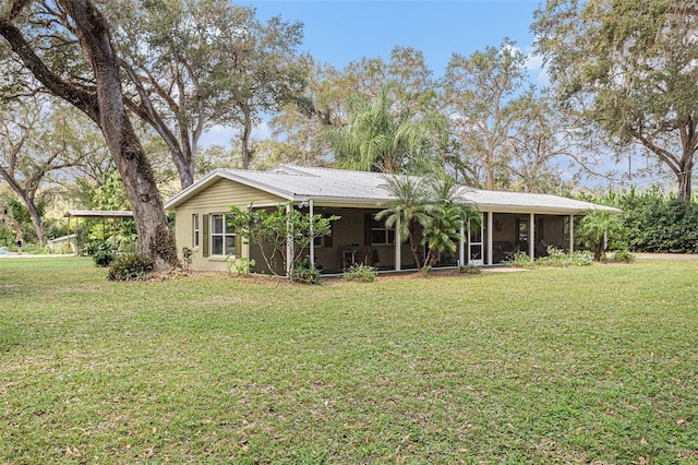 back of property with a lawn