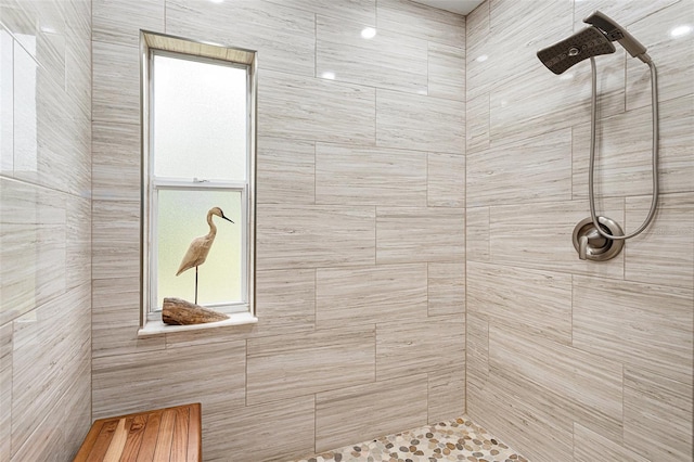 bathroom with tiled shower