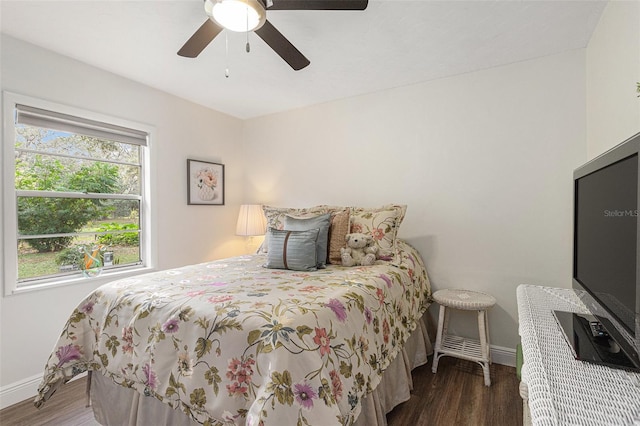 bedroom featuring dark wood-type flooring and ceiling fan