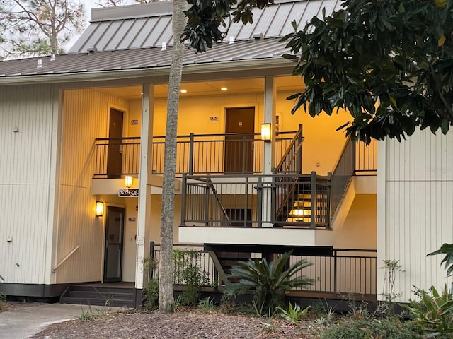 29254 Bay Hollow Dr Unit 3262, Wesley Chapel, FL 33543 - view of exterior entry featuring a standing seam roof and metal roof