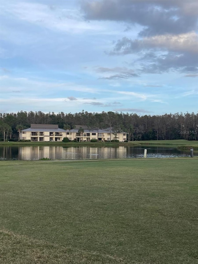 29254 Bay Hollow Dr Unit 3262, Wesley Chapel, FL 33543 - view of green lawn with a water view