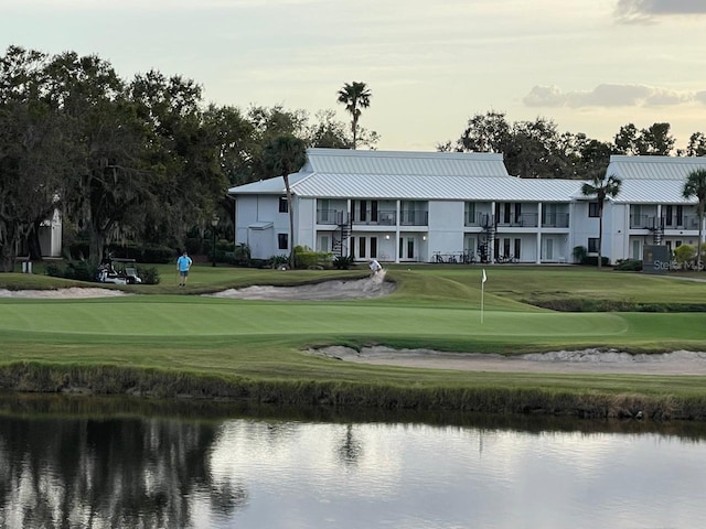 29254 Bay Hollow Dr Unit 3262, Wesley Chapel, FL 33543 - view of property's community featuring a putting area, a yard, a water view, and view of golf course