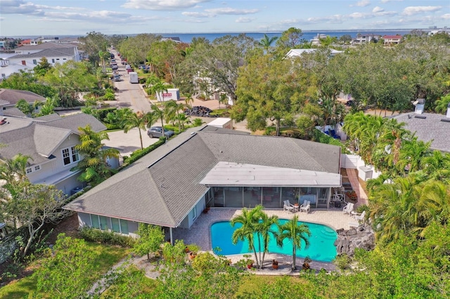 birds eye view of property with a water view