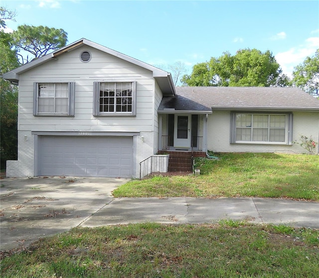 view of front facade featuring a garage and a front yard