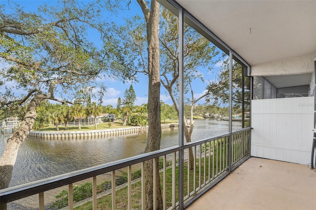 balcony featuring a water view