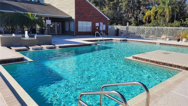 view of swimming pool with a patio area