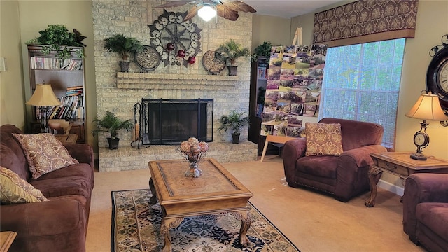 carpeted living room featuring ceiling fan and a fireplace