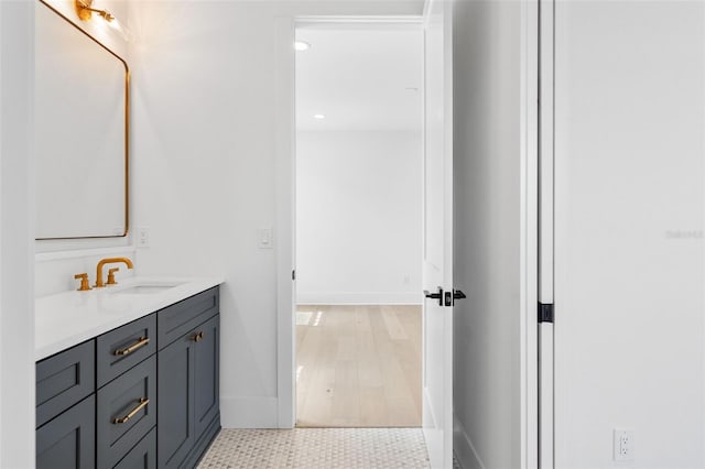 bathroom featuring hardwood / wood-style floors and vanity