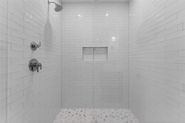 bathroom with tiled shower