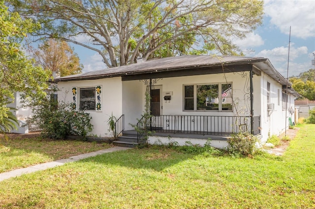 view of front of home with a porch and a front lawn