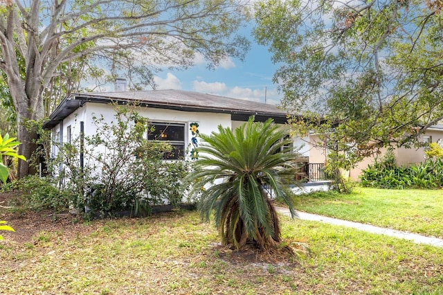 view of home's exterior featuring a lawn