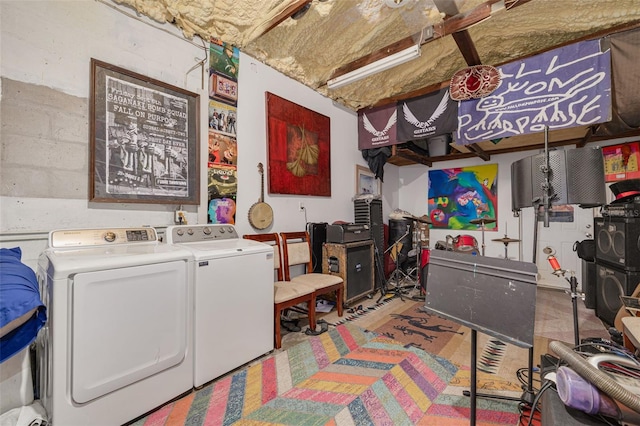 laundry area featuring washing machine and clothes dryer