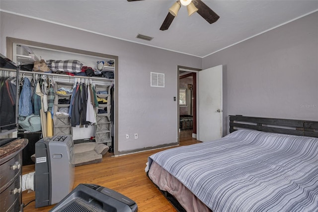 bedroom featuring a closet, ceiling fan, and light hardwood / wood-style flooring