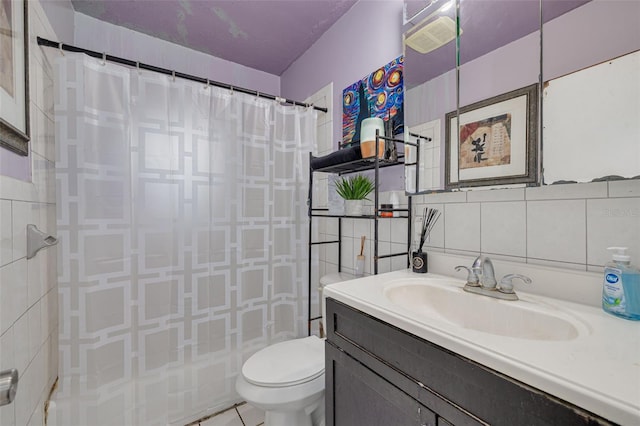 bathroom with a shower with shower curtain, vanity, toilet, and tile walls