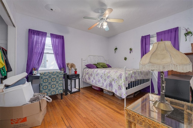 bedroom featuring hardwood / wood-style flooring and ceiling fan