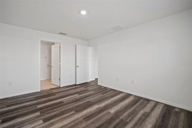 unfurnished bedroom featuring dark wood-type flooring