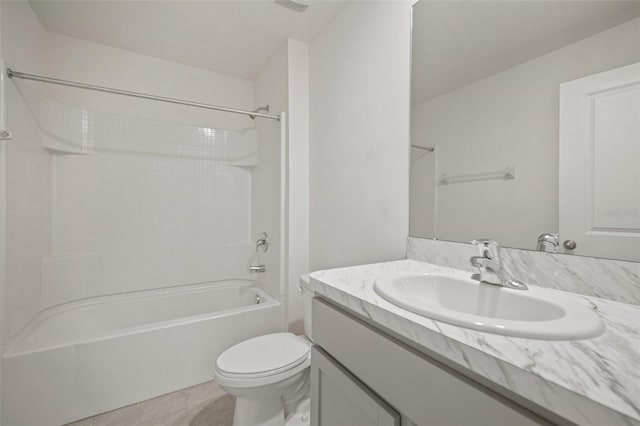 full bathroom with toilet, washtub / shower combination, vanity, and tile patterned floors