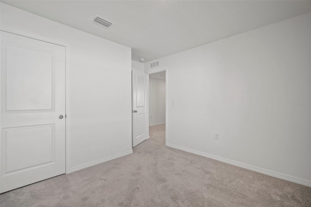 interior space featuring light colored carpet