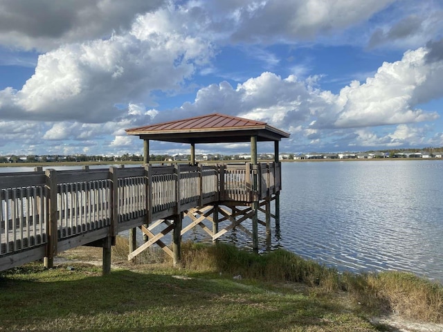 dock area with a gazebo and a water view