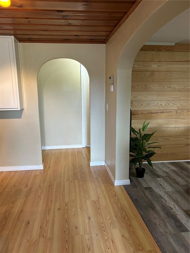 hallway with wooden ceiling and light wood-type flooring