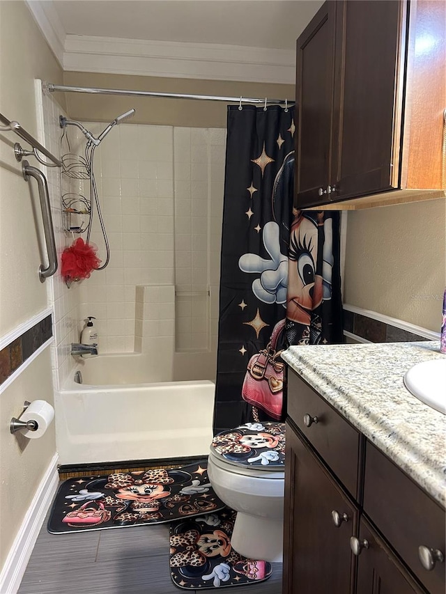 full bathroom with ornamental molding, vanity, shower / bath combo, and toilet