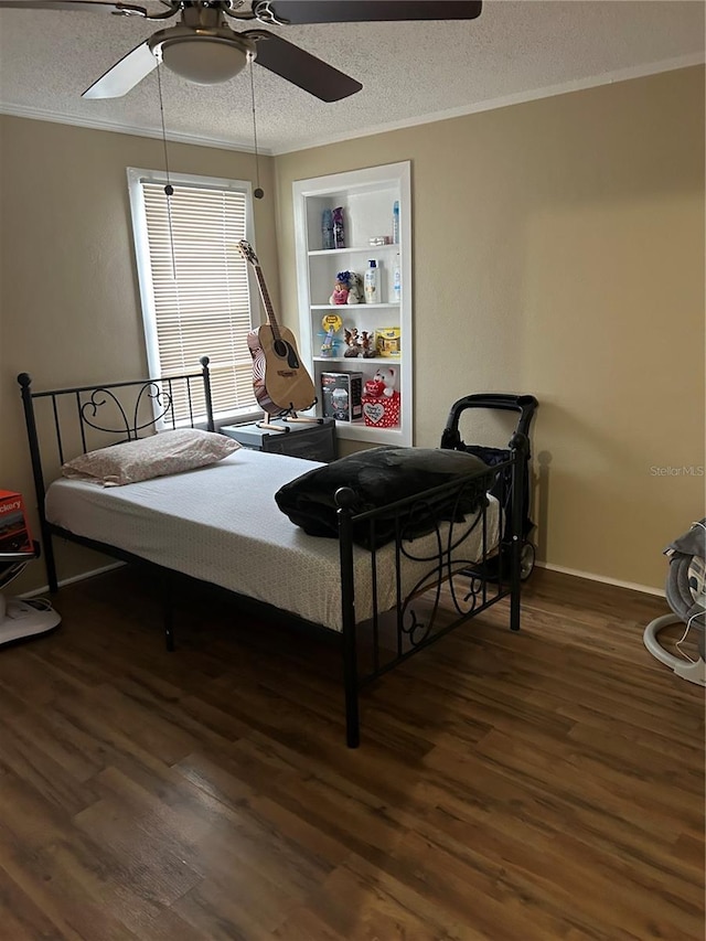 bedroom featuring ceiling fan, dark hardwood / wood-style floors, a textured ceiling, and crown molding