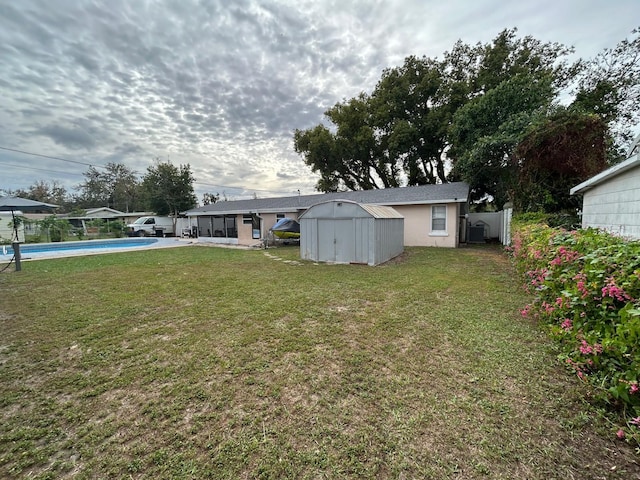 view of yard with a storage unit