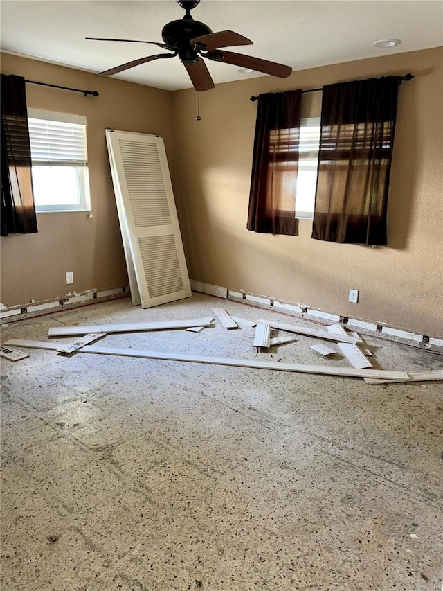 empty room featuring ceiling fan