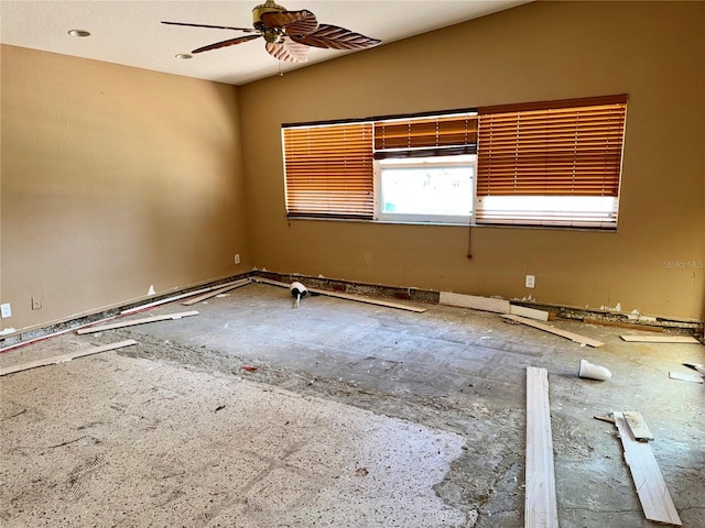 unfurnished room with ceiling fan