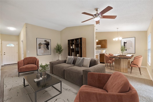 living area with light carpet, vaulted ceiling, a textured ceiling, baseboards, and ceiling fan with notable chandelier