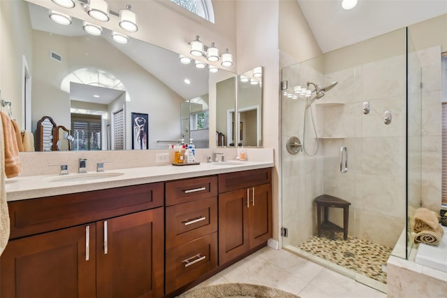 bathroom featuring tile patterned flooring, vanity, high vaulted ceiling, and a shower with shower door