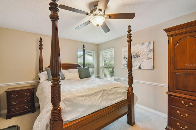 bedroom with light carpet and ceiling fan