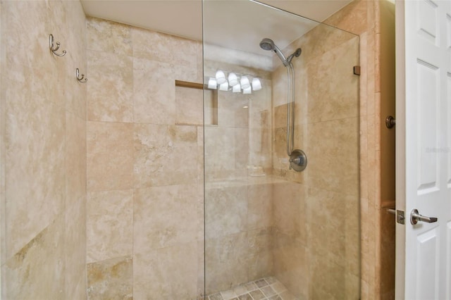 bathroom with tiled shower