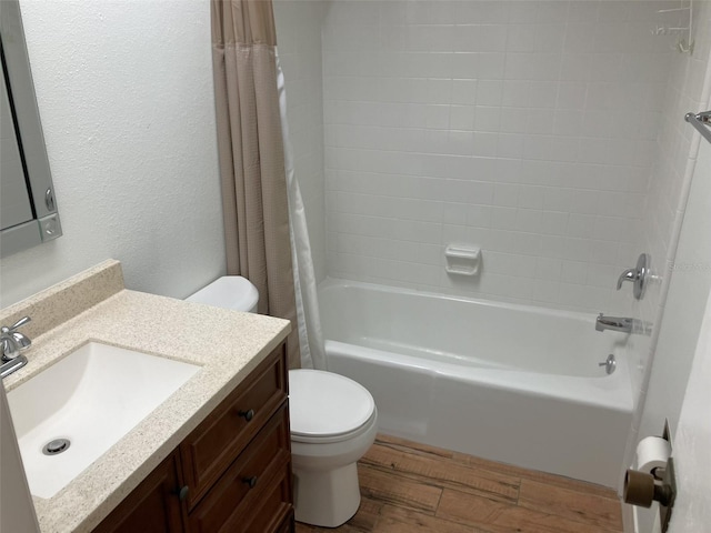 full bathroom with hardwood / wood-style flooring, vanity, toilet, and shower / bath combo