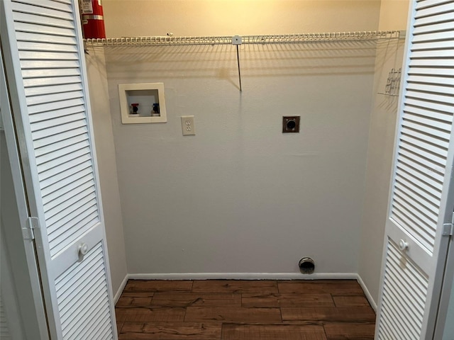 laundry room featuring hookup for an electric dryer, hookup for a washing machine, and dark hardwood / wood-style flooring