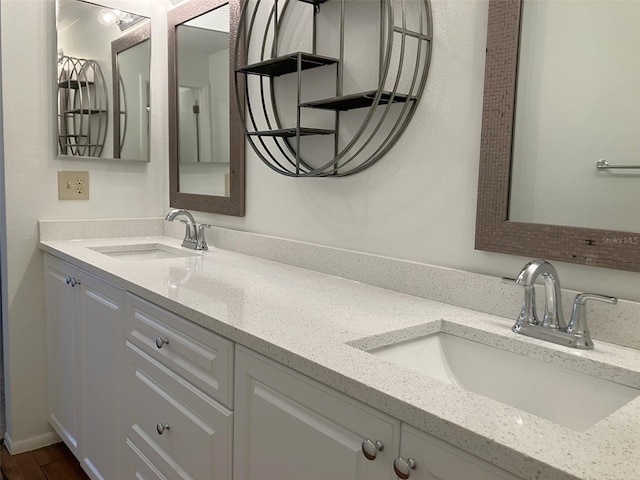 bathroom featuring vanity and hardwood / wood-style flooring