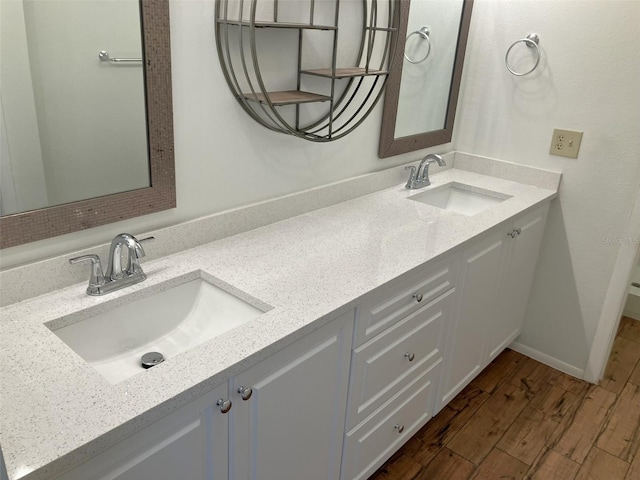 bathroom with hardwood / wood-style floors and vanity