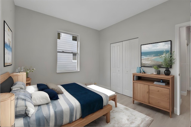 bedroom featuring light hardwood / wood-style flooring and a closet