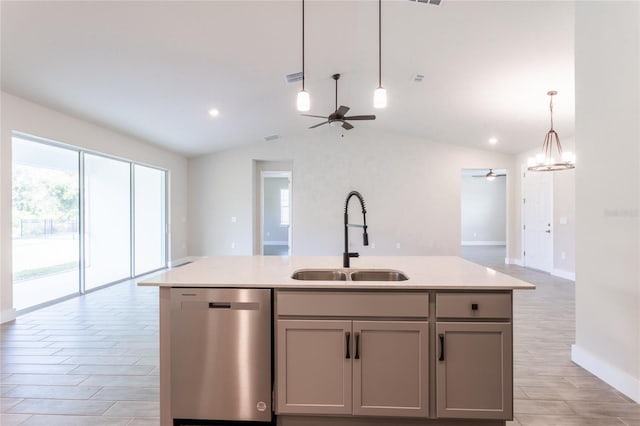 kitchen featuring lofted ceiling, gray cabinetry, sink, and dishwasher