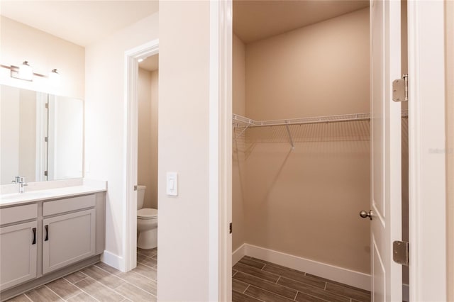 bathroom with vanity and toilet