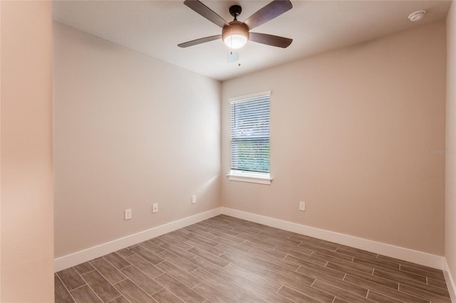 empty room with wood-type flooring and ceiling fan