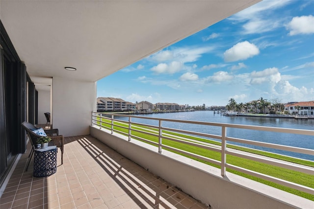 balcony featuring a water view