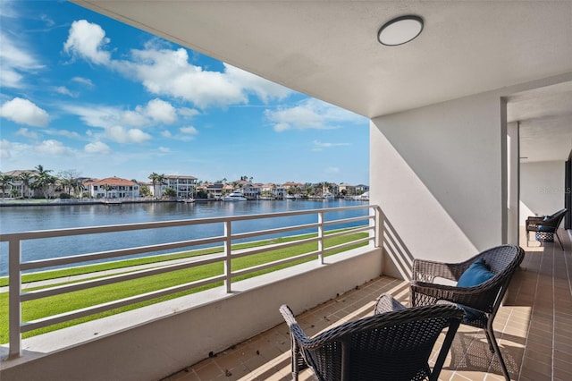 balcony featuring a water view