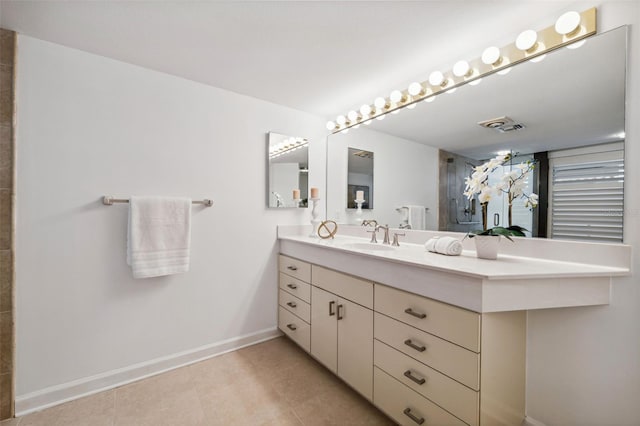 bathroom featuring tile patterned flooring and vanity